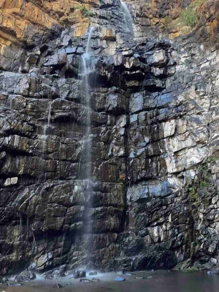 A cascading waterfall over a rugged cliff in the Adelaide Hills, an inviting destination among the things to do in Adelaide Hills in winter.