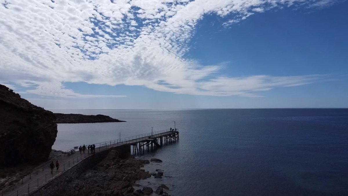 second valley Scenic view of the jetty at Second Valley extending over calm, clear waters, capturing the serene beauty of one of Fleurieu Peninsula's most stunning beaches.