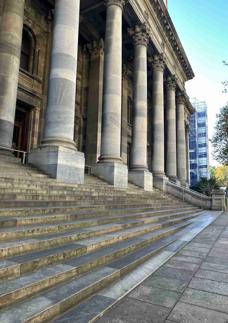 Front view of Parliament House in Adelaide, featuring grand marble steps and towering Corinthian columns. This important civic building is one of the most iconic historic landmarks in Adelaide, representing the city’s political and architectural heritage.