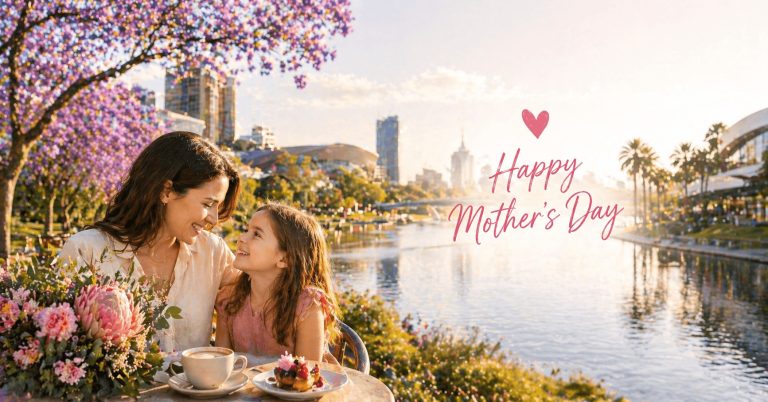 Mother and daughter enjoying Mother’s Day in Adelaide by the river, sharing coffee and dessert with city views and pink floral trees, alongside text promoting things to do like lunch spots, gardens, shopping, and memorable experiences.